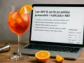Aperol spritz z pomarańczą i laptopem prezentującym kalkulator ABV. Dowiedz się, jaki rum ile procent ma w drinku.