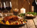 Idealne wino do drobiu? Pieczony drób z ziemniakami i kieliszki czerwonego wina tworzą przytulną atmosferę.